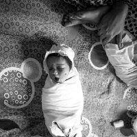 Neenad Arul - Ready for the day. Swaddling is the art of snugly wrapping a baby in a blanket for warmth and security