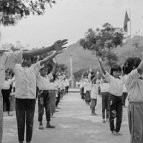 Sascha Richter - Children are performing to a Communist Party of Vietnam's song that is played every day at school