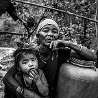 Szymon Barylski  -  Maldhani Gurung a 70-year-old woman with her granddaughter in the village of Baluwa, Gorkha District, near the epicentre of the 2015 earthquake.