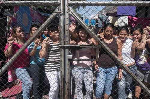 John Sevigny - Women lined up against the front gate of the Ilopango prison for women in San Salvador. 