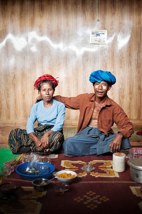 Bart De Bock - A couple in a remote village in Shan State. Because guests are in their house, the man does not want to put his hand on his wife, so he's 'hover-handing'. Showing affection is not allowed when there are visitors, according to tradition.